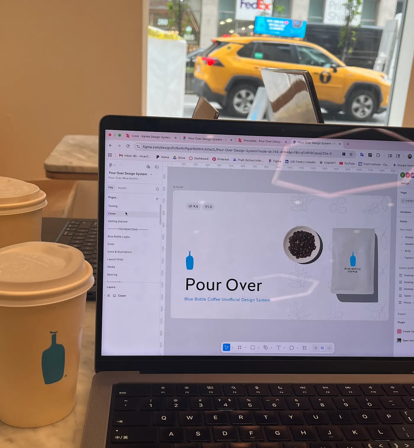 A laptop open to the Pour Over Figma file on a table at Blue Bottle Cafe